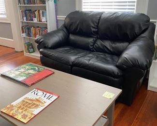 Coffee table & leather loveseat, sold separately. 