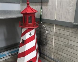 Outdoor lighthouse that lights up on the inside. Handcrafted.