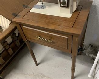 New Home sewing machine in cabinet