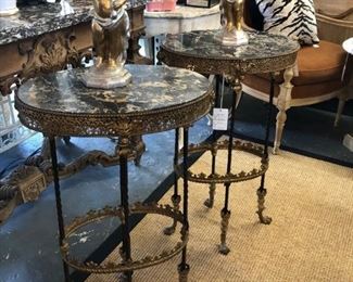 Pair of 19th century bronze candlestands with oval marble tops.