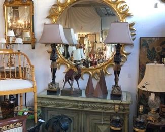 Huge giltwood sunburst mirror, painted credenza with aged mirrored top.