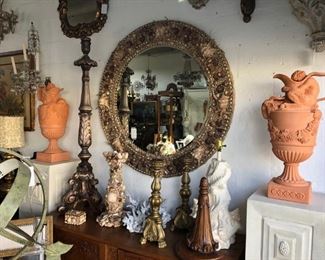 Round seashell encrusted mirror, pair fine terracotta urns, pair pricket sticks, blue coral.