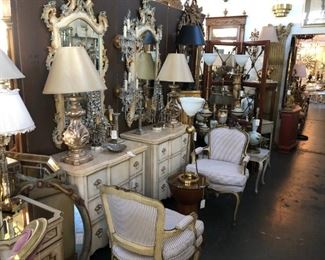 Pair of painted nightstands, pair of painted Italian Venetian mirrors, pair of 19th century painted and parcel gilt Louis XV fauteuils, pair of silvergilt finial lamps.
