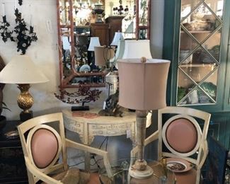 Pair of painted Italian armchairs, painted Chinese demilune console, Lucite occasional table with brass accents, Travertine Art Deco lamp, painted pagoda form mirror.