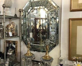 Octagonal Venetian mirror, pair of Baccarat urn-form lamps by Paul Hanson.