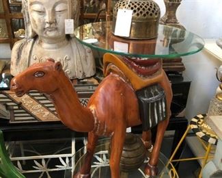Carved and polychromed pine camel table, large carved wood Quan Yin bust.