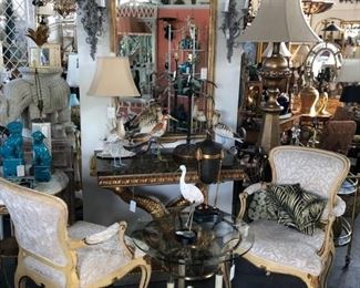 Pair of Venetian painted armchairs, painted and parcel gilt classical trumeau, giltwood dolphin console with stone top, collection of hand painted sea birds.