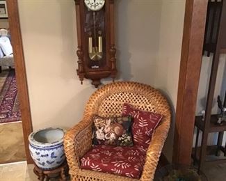 Walnut clock and wicker chair 