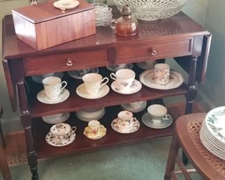 Tea Cart. Collection Tea cups and saucers.