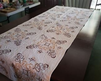 Quilt runner. Drop leaf dining table.