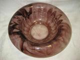 A PURPLE AND CLEAR SLAG GLASS BOWL WITH A SATAN BOTTOM, 9 INCHES IN DIAMETER