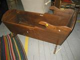 ANTIQUE WOOD CRADLE, DOVE TAIL , LOOKS TO BE WALNUT , MEASURES 44 INCHES LONG, 24 INCHES WIDE, STANDS 23 INCEHS