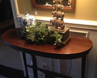 Demilune table; stacked elephants lamp