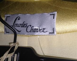 Lourdes Chavez yellow suit