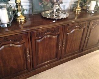 Four-door buffet/credenza provides upper display space and lower storage