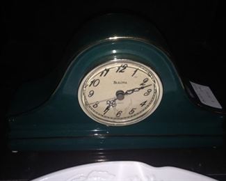 Small dark green clock
