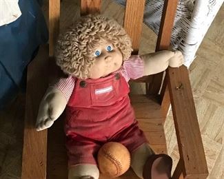 Cabbage Patch doll in child's rocker
