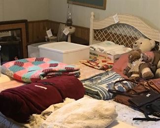 King size wicker bed & some if the many linens