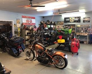 Entire garage full of motorcycle parts and tools.
