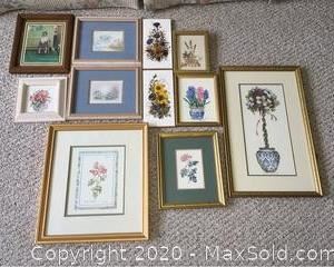 An assortment of framed prints