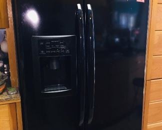 side by side refrigerator with water and ice in the door