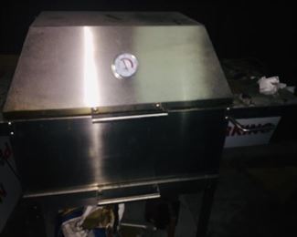 like new stainless steel barbeque pit