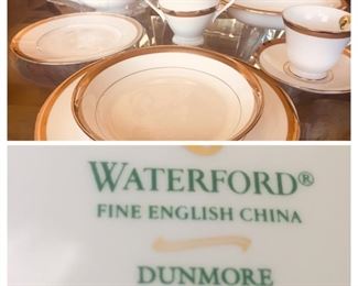 Place setting for 11. Brand new Waterford China with serving pieces. 