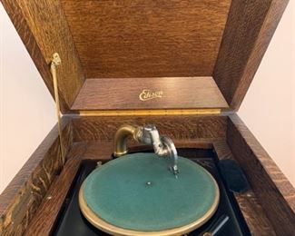 #3	1915 Edison Diamond Disc Phonograph Record Player. Tiger oak cabinet with 79 discs.  It has a needle, the key and it works! 23"x22"x50"	 $600.00 