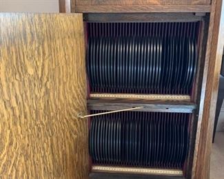 #3	1915 Edison Diamond Disc Phonograph Record Player. Tiger oak cabinet with 79 discs.  It has a needle, the key and it works! 23"x22"x50"	 $600.00 