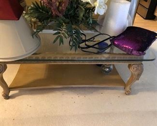 Coffee table with floating glass, carved wood acanthus leaf corner legs