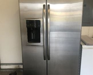 Nice/clean fairly newer GE stainless side by side. Per homeowner, water line works perfectly. Recently upgraded and moved this to the garage.