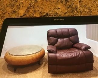 Circular coffee table with motorized oversize  recliner