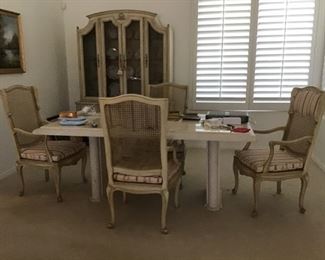  Travertine Dining Table -4 cane back armchairs , Priced seperately .Matching hutch with light