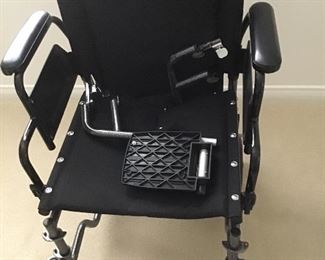 Transport wheelchair with brakes,leg  & ft. attachments