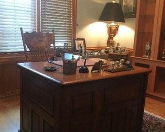 Antique oak desk with oak office chair , unique lamp with light reflecting shade