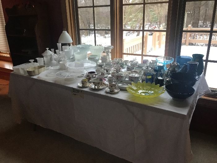 Glassware galore in fantastic condition.  Tea cups/saucers enough for a bridal shower, hobnail White glassware, cake stands, blue glassware etc.,.