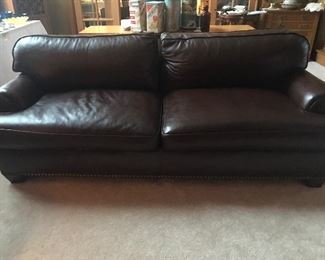 Supple brown leather couch to put you asleep by the fire.