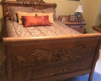 Marvelous vintage oak full sized bed will put you to sleep easily.  Notice the detail work on the headboard and footboard.