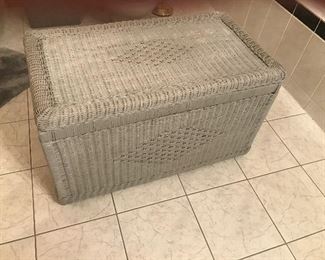 Wicker trunk used in bathroom for storage of towels, supplies, hair products, etc.,.