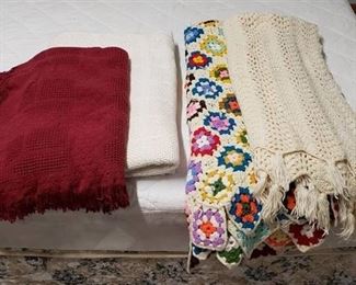 Lot of Blankets/Throws - 1 Off White Cotton Blanklet, 1 Burgundy Cotton Throw, 1 Multi-colored Afghan, and 1 Cream Afghan Throw