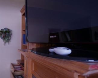 One of three TVs for sale; two at $100, one free to someone who can lift it and haul it away