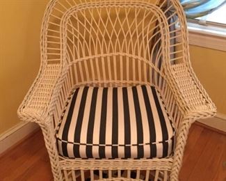 White rocker with black and white striped cushion.