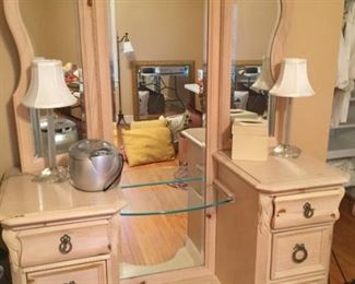 Vanity with tri-fold mirror.