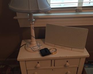 Small chest of drawers and lamp.