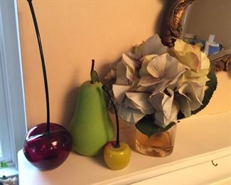 Glass and ceramic fruit.