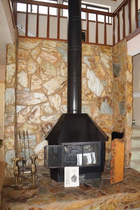 Nice freestanding fireplace with electric insert.  We will be selling it.  It will be removed after the sale and made available for pickup.  