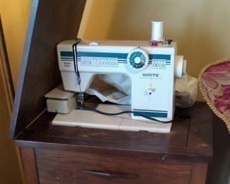 White sewing machine with cabinet