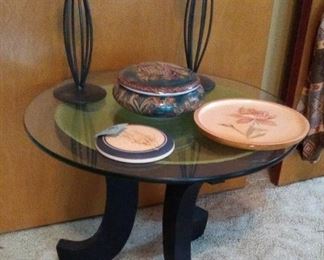 Cute little side table.  Top of base is a bowl so you can use it for displaying a collection.