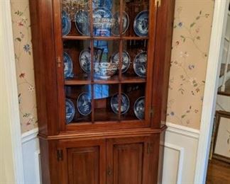 Vintage cherry corner cabinet.