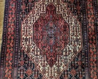 Vintage handwoven Persian Bijar wool rug, measures 4' x 5'.